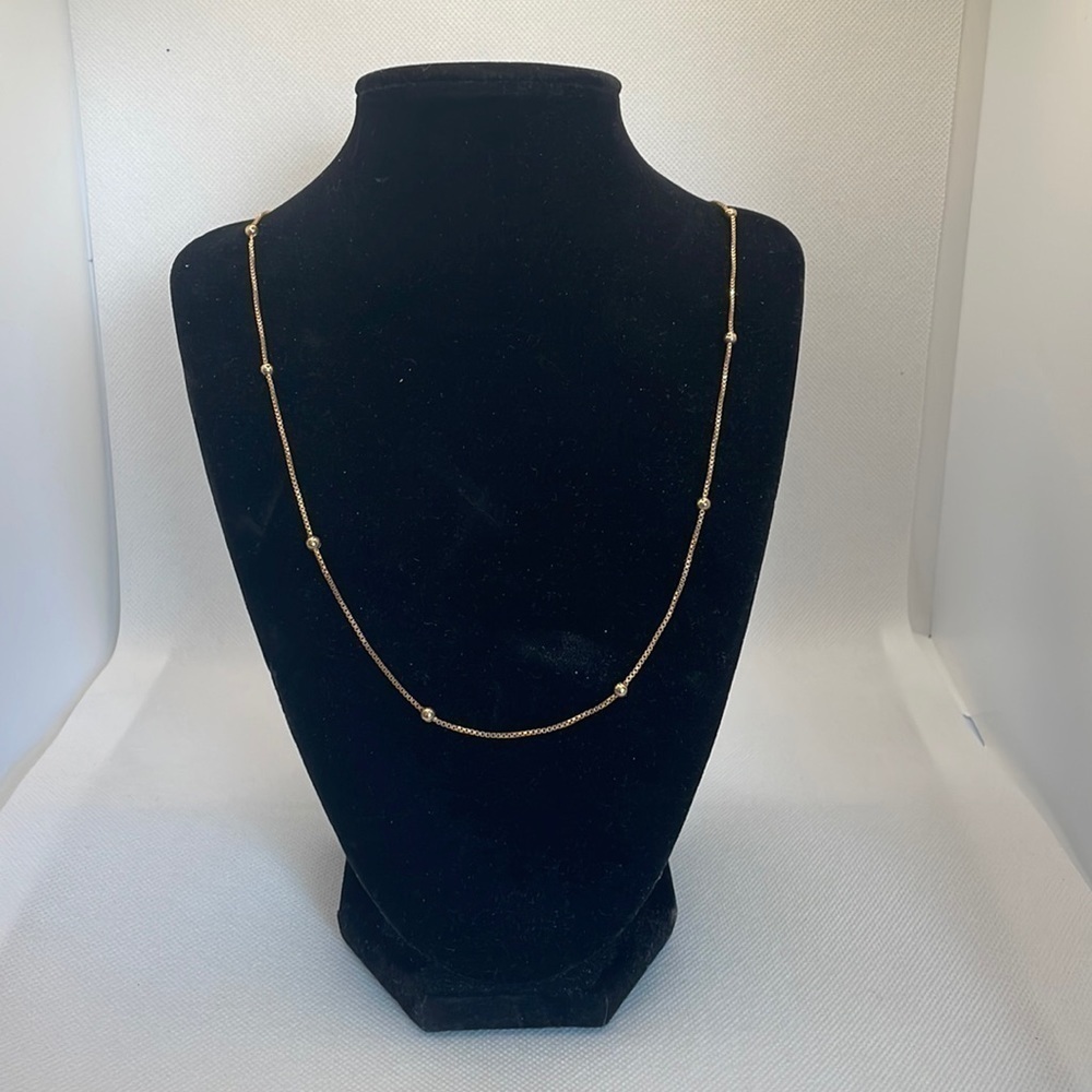 14kt gold, 24 inch box chain with balls spaced every 2 inches.